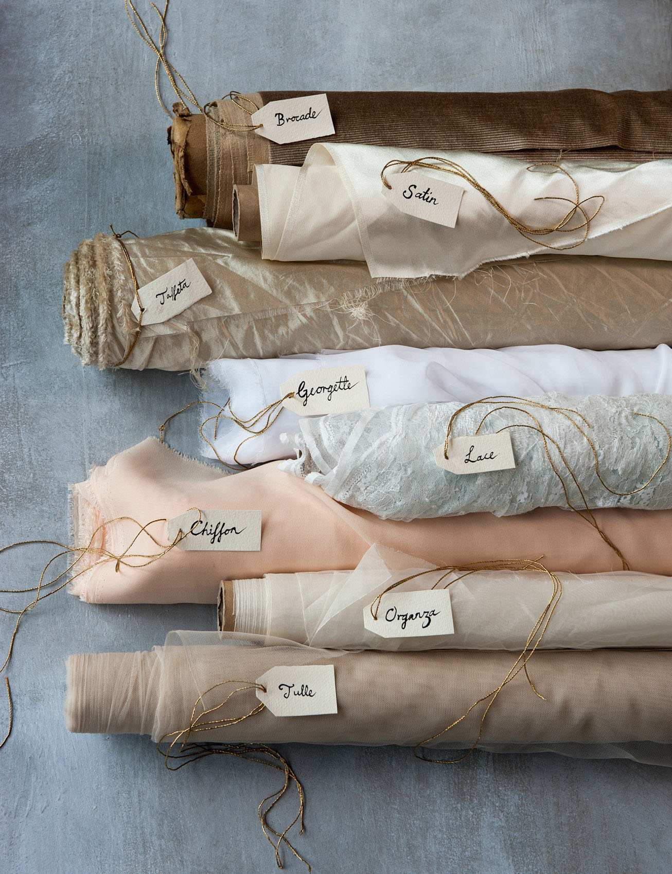 O18-390-3 Bolts of pastel coloured silks